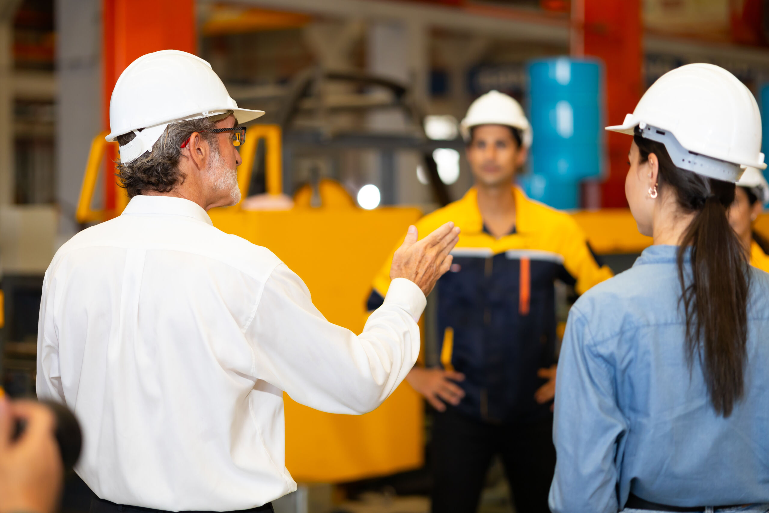 Morning Brief meeting. Professional supervisor engineers assignmenting discussion together before start working In morning meeting. metal sheet profiling factory. Industrial production